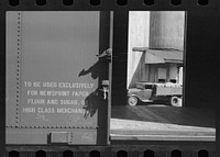Empty freight car, truck, grain elevator, Minneapolis, Minnesota. Sourced from the Library of Congress.