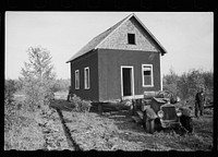 Farmer of cut-over land moving house to new land. The government bought up the land on which he formerly farmed to take it out of farming. Lake of the Woods County, Minnesota. Sourced from the Library of Congress.