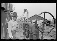 Farm boy who operates tractor, Jasper County, Iowa. Sourced from the Library of Congress.