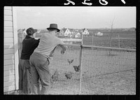 Farm manager talking with farmer at Granger Homesteads, Iowa. Sourced from the Library of Congress.