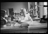 Grain inspector at state grain inspection deptartment, Minneapolis, Minnesota. Sourced from the Library of Congress.