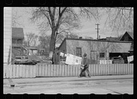 [Untitled photo, possibly related to: Workman going home, Dubuque, Iowa]. Sourced from the Library of Congress.