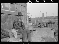 [Untitled photo, possibly related to: Man who lives in shack on the edge of the city dump, Dubuque, Iowa]. Sourced from the Library of Congress.