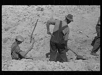 [Untitled photo, possibly related to: Farmers who have been resettled at Skyline Farms, at work in sand pit]. Sourced from the Library of Congress.