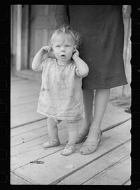 [Untitled photo, possibly related to: Child of Ozark Mountains farmer, Missouri]. Sourced from the Library of Congress.