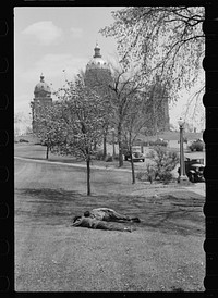 Men sleeping on lawn of state capitol, Des Moines, Iowa. Sourced from the Library of Congress.