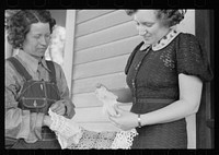 Rehabilitation borrower showing lace work she has made to home supervisor, Grant County, Illinois. Sourced from the Library of Congress.