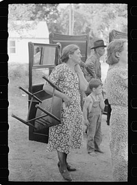 Auction sales in Greene County are frequent because as farm conditions became worse families move into smaller houses and sell excess furniture. Owensburg, Indiana. Sourced from the Library of Congress.