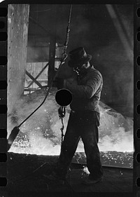 [Untitled photo, possibly related to: Pouring a test mold while blast furnace is being tapped, Pittsburgh, Pennsylvania]. Sourced from the Library of Congress.