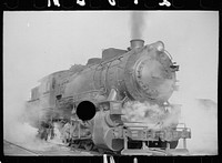 [Untitled photo, possibly related to: Locomotive in railroad yards along river, St. Louis, Missouri]. Sourced from the Library of Congress.