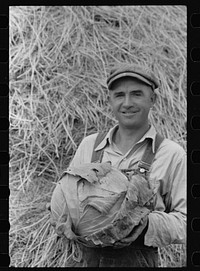 [Untitled photo, possibly related to: Howard Crowder displays some of the vegetables produced in his garden on San Luis Valley Farms, Alamosa, Colorado]. Sourced from the Library of Congress.