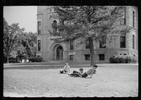 Boys playing on courthouse lawn, Grundy Center, Iowa. Sourced from the Library of Congress.