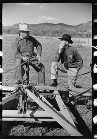 County supervisor George Stewart (right) discusses farm problems with rehabilitation client Russel D. Glenn in Chaffee County, Colorado. Sourced from the Library of Congress.