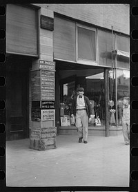 [Untitled photo, possibly related to: Newsboy on main street, Montrose, Colorado]. Sourced from the Library of Congress.