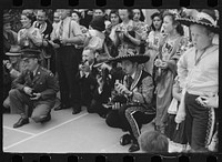 Tourists at costume show, Charro Days, Brownsville, Texas. Sourced from the Library of Congress.