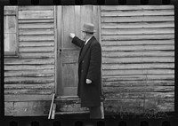 Resettlement Administration representative at door of rehabilitation client's house, Jackson County, Ohio. Sourced from the Library of Congress.