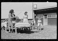 [Untitled photo, possibly related to: In front of the community store, FSA (Farm Security Administration) camp, Sinton, Texas]. Sourced from the Library of Congress.