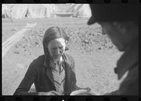 Woman at mealtime in the camp for white flood refugees, Forrest City, Arkansas. Sourced from the Library of Congress.
