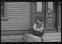 [Untitled photo, possibly related to: Woman sitting on step, Manchester, New Hampshire]. Sourced from the Library of Congress.