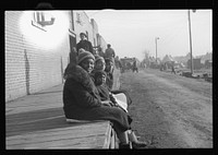 [Untitled photo, possibly related to: Lined up and waiting for a meal in the camp for  flood refugees at Forrest City, Arkansas]. Sourced from the Library of Congress.