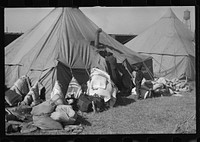 [Untitled photo, possibly related to: A  flood refugee family who, with their rescued household goods have moved into the camp at Forrest City, Arkansas]. Sourced from the Library of Congress.