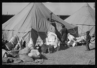 [Untitled photo, possibly related to: A  flood refugee family who, with their rescued household goods have moved into the camp at Forrest City, Arkansas]. Sourced from the Library of Congress.