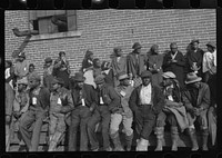  flood refugees wearing identification tags after registering in the camp at Forrest City, Arkansas. Sourced from the Library of Congress.