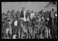 [Untitled photo, possibly related to:  flood refugees wearing identification tags after registering in the camp at Forrest City, Arkansas]. Sourced from the Library of Congress.