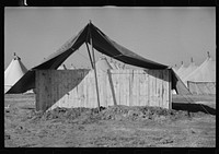 [Untitled photo, possibly related to: A street of tents in the camp for flood refugees of Forrest City, Arkansas]. Sourced from the Library of Congress.