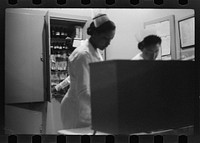 [Untitled photo, possibly related to: Staff doctor entering Provident Hospital, Chicago, Illinois]. Sourced from the Library of Congress.