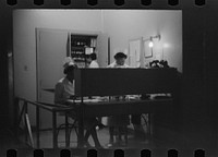 [Untitled photo, possibly related to: Staff doctor entering Provident Hospital, Chicago, Illinois]. Sourced from the Library of Congress.