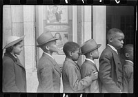 Children in front of moving picture theater, Easter Sunday matinee, Black Belt, Chicago, Illinois. Sourced from the Library of Congress.