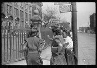 Young people outside of  high school, Black Belt, Chicago, Illinois. Sourced from the Library of Congress.