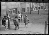 Children in front of apartment buildings in one of the better neighborhoods in the Black Belt, Chicago, Illinois. Sourced from the Library of Congress.