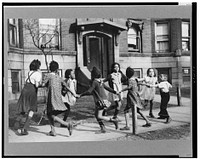 Children playing "ring around a rosie" in one of the better neighborhoods of the Black Belt, Chicago, Illinois. Sourced from the Library of Congress.