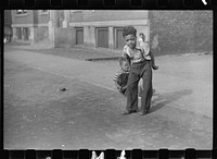[Untitled photo, possibly related to: Children playing on the street, Chicago, Illinois]. Sourced from the Library of Congress.