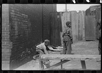 [Untitled photo, possibly related to: Children playing on the street, Black Belt, Chicago, Illinois]. Sourced from the Library of Congress.