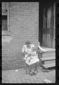 [Untitled photo, possibly related to: Mother and child. Alley dwelling area. Washington, D.C.]. Sourced from the Library of Congress.