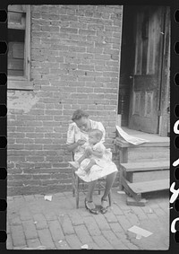 [Untitled photo, possibly related to: Mother and child. Alley dwelling area. Washington, D.C.]. Sourced from the Library of Congress.