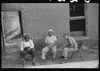 [Untitled photo, possibly related to: es in front of their homes in the alley dwelling area, Washington, D.C.]. Sourced from the Library of Congress.