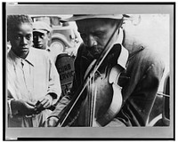 Blind street musician, West Memphis, Arkansas. Sourced from the Library of Congress.