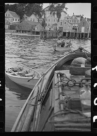 Aboard a trap fishing boat, the end of the trip. About four hours after they have left (in the dark) fishermen return home. By eight o'clock, sometimes nine o'clock, the day's work is finished. Provincetown, Massachusetts. Sourced from the Library of Congress.