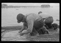 Fishermen repairing nets, Provincetown, Massachusetts. Sourced from the Library of Congress.