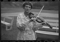 Aunt Samantha Baumgarner [i.e. Bumgarner], fiddler, banjoist, guitarist, North Carolina, Asheville. Sourced from the Library of Congress.