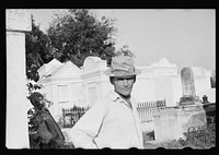 Tomb painter in cemetery at Pointe a la Hache, Louisiana. Sourced from the Library of Congress.