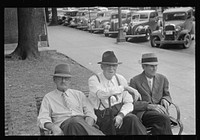 Men sitting on bench in square, Springfield, Ohio. Sourced from the Library of Congress.