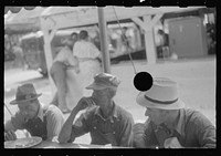 [Untitled photo, possibly related to: Spectators at county fair eating lunch, central Ohio]. Sourced from the Library of Congress.