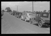 Farmers' cars parked along highway near a public auction, central Ohio. Sourced from the Library of Congress.
