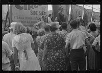 Spectators at sideshow, county fair, central Ohio. Sourced from the Library of Congress.