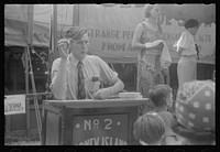 Selling tickets to the sideshow, county fair, central Ohio. Sourced from the Library of Congress.